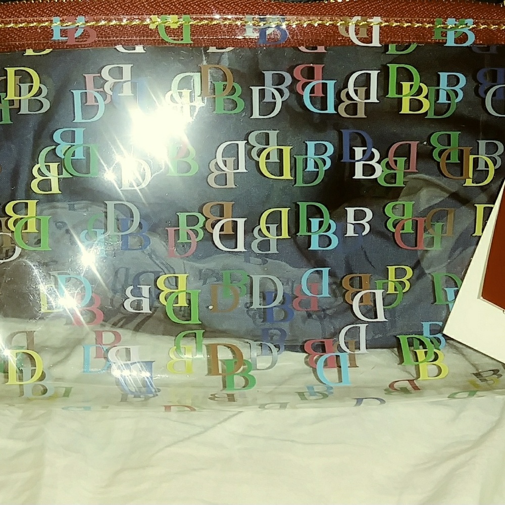 Dooney and Bourke clear cosmetic travel case